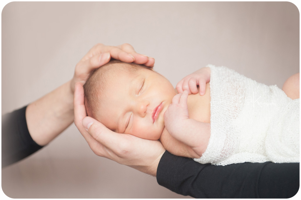 newborn in parents hands