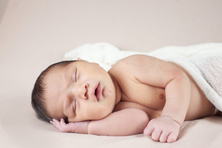 newborn photographer Nina K photographs baby in white blanket, based in Maryland, near Baltimore and DC